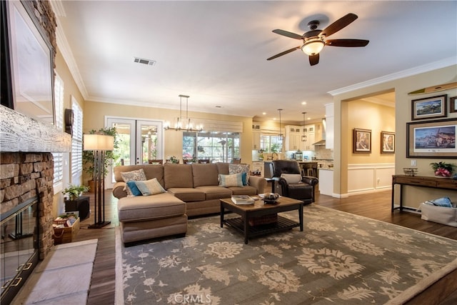 42926 Joshua Tree Ct, Murrieta, CA 92562 - living area featuring a ceiling fan, crown molding, dark wood-type flooring, and a glass covered fireplace