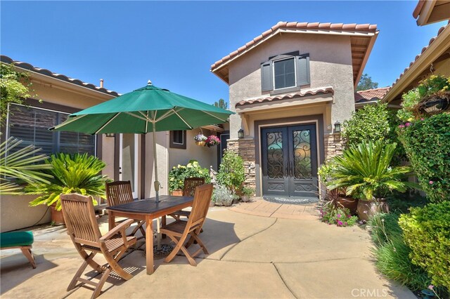 42926 Joshua Tree Ct, Murrieta, CA 92562 - view of patio featuring french doors and outdoor dining space