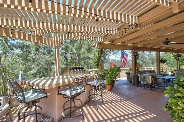 42926 Joshua Tree Ct, Murrieta, CA 92562 - view of patio featuring a pergola and exterior kitchen