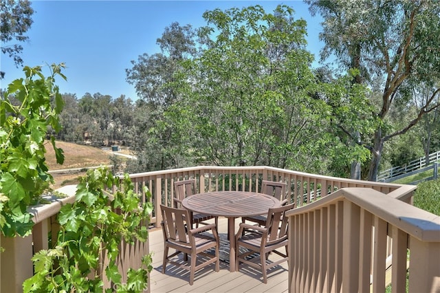 42926 Joshua Tree Ct, Murrieta, CA 92562 - wooden deck with outdoor dining space and view of scattered trees