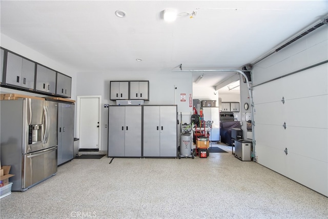 42926 Joshua Tree Ct, Murrieta, CA 92562 - garage with stainless steel fridge with ice dispenser and recessed lighting