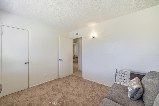 45409 Rodin Ave, Lancaster, CA 93535 - living area featuring carpet flooring and a textured ceiling
