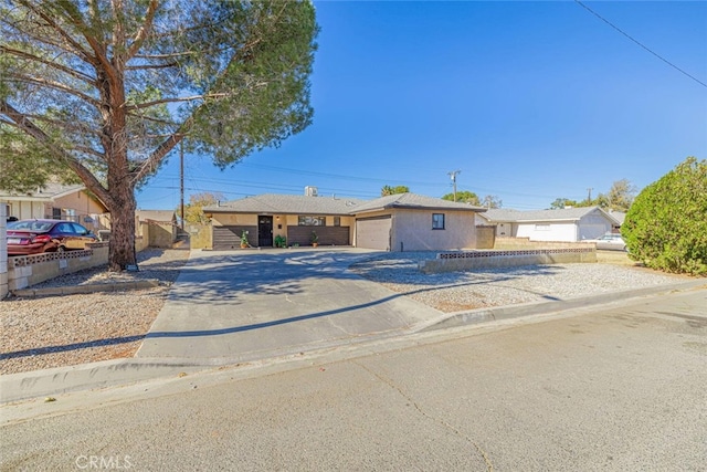 45409 Rodin Ave, Lancaster, CA 93535 - single story home with concrete driveway and a garage