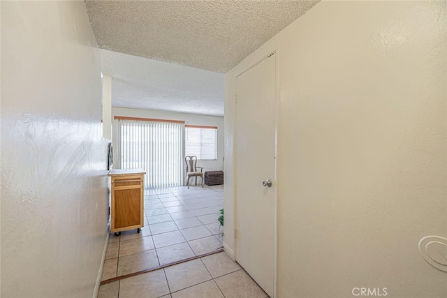 45409 Rodin Ave, Lancaster, CA 93535 - hall featuring a textured ceiling and light tile patterned floors