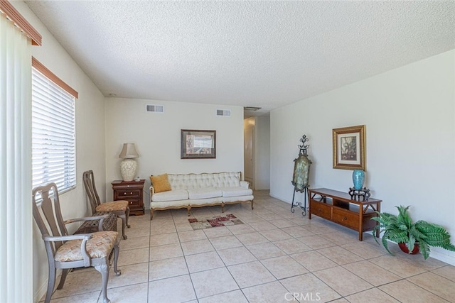 45409 Rodin Ave, Lancaster, CA 93535 - living area with a textured ceiling and light tile patterned floors