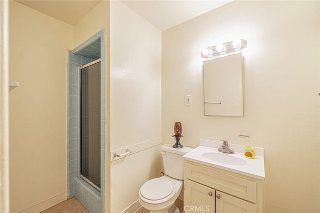 45409 Rodin Ave, Lancaster, CA 93535 - full bath with tiled shower, toilet, vanity, and tile patterned flooring