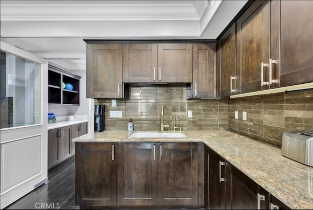 155 Cordova St Unit 203, Pasadena, CA 91105 - kitchen with dark brown cabinetry, ornamental molding, decorative backsplash, dark wood-style floors, and light stone countertops