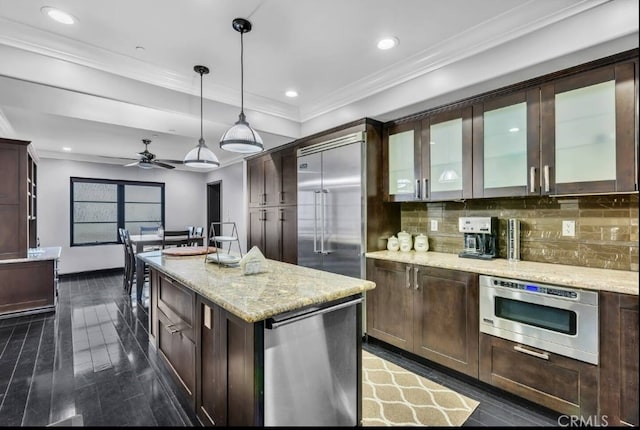 155 Cordova St Unit 203, Pasadena, CA 91105 - kitchen featuring tasteful backsplash, dark brown cabinetry, dark wood-style flooring, recessed lighting, and hanging light fixtures