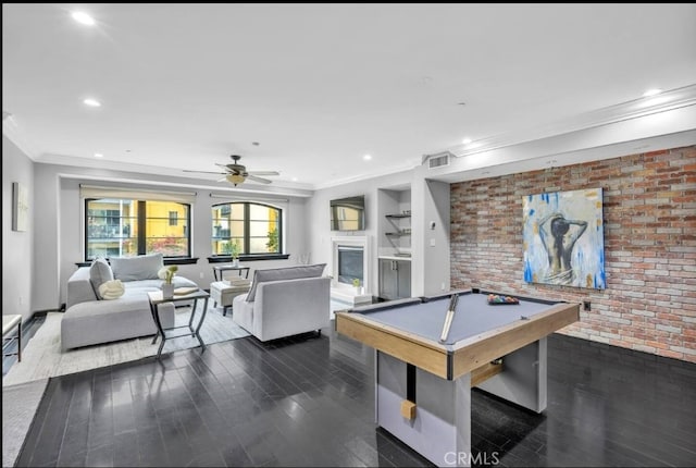 155 Cordova St Unit 203, Pasadena, CA 91105 - game room with crown molding, dark wood finished floors, pool table, ceiling fan, and brick wall