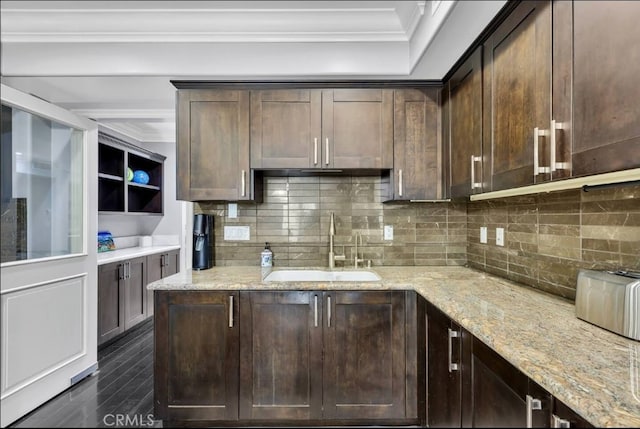 155 Cordova St Unit 203, Pasadena, CA 91105 - kitchen with dark brown cabinetry, crown molding, backsplash, light stone counters, and dark wood-type flooring