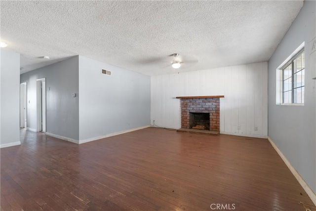 35921 80th St E, Littlerock, CA 93543 - unfurnished living room with wood-type flooring, ceiling fan, a textured ceiling, and baseboards