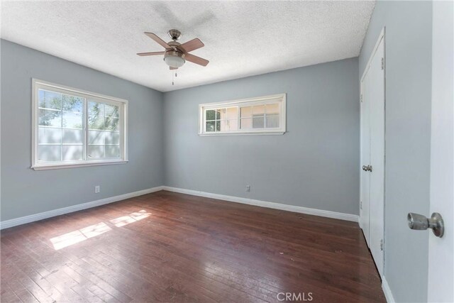 35921 80th St E, Littlerock, CA 93543 - spare room featuring healthy amount of natural light, wood-type flooring, a ceiling fan, and a textured ceiling