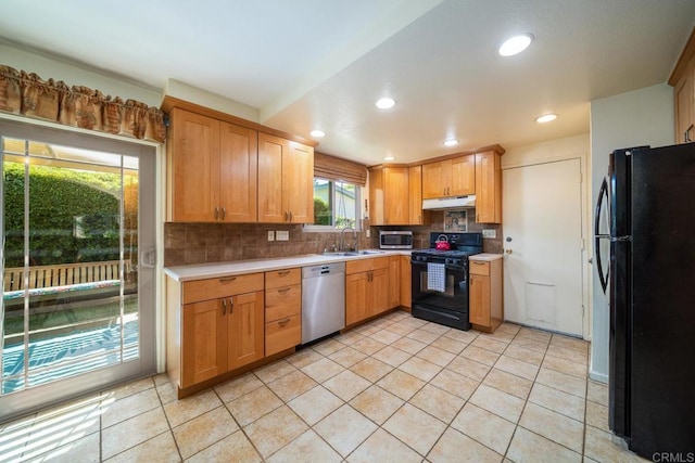 905 Discovery St, San Marcos, CA 92078 - kitchen with black appliances, under cabinet range hood, a sink, light countertops, and recessed lighting