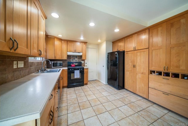 905 Discovery St, San Marcos, CA 92078 - kitchen featuring black appliances, under cabinet range hood, a sink, light countertops, and backsplash