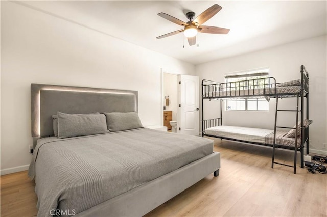 589 S Mountain View Dr, Palm Springs, CA 92264 - bedroom with wood finished floors, baseboards, ceiling fan, and connected bathroom