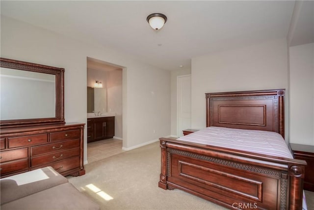 3212 Willow Creek Rd, West Covina, CA 91791 - bedroom featuring light carpet, ensuite bathroom, baseboards, and a sink
