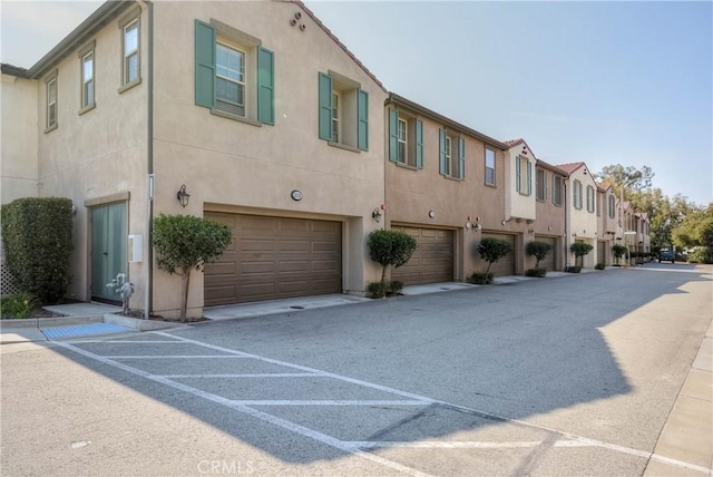 3212 Willow Creek Rd, West Covina, CA 91791 - view of property with an attached garage and a residential view