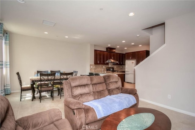 3212 Willow Creek Rd, West Covina, CA 91791 - living room featuring recessed lighting, light tile patterned floors, and baseboards