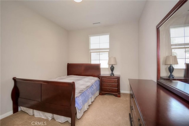 3212 Willow Creek Rd, West Covina, CA 91791 - bedroom featuring light carpet, multiple windows, and baseboards