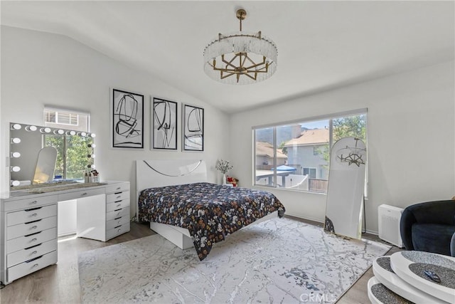 27051 Featherhill Dr, Corona, CA 92883 - bedroom featuring lofted ceiling, wood finished floors, and a chandelier