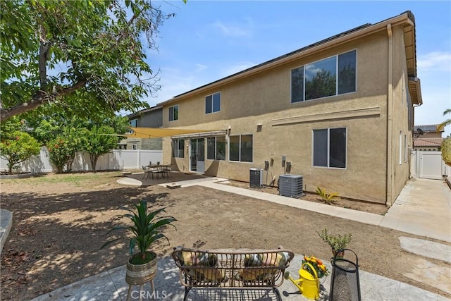 27051 Featherhill Dr, Corona, CA 92883 - back of property featuring a patio, stucco siding, a fenced backyard, and central AC