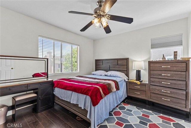 27051 Featherhill Dr, Corona, CA 92883 - bedroom featuring dark wood-style floors and ceiling fan