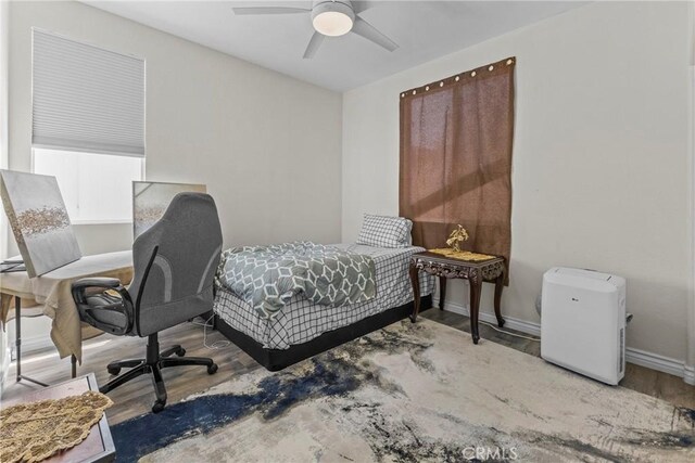 27051 Featherhill Dr, Corona, CA 92883 - bedroom featuring wood finished floors, baseboards, a ceiling fan, and an office area
