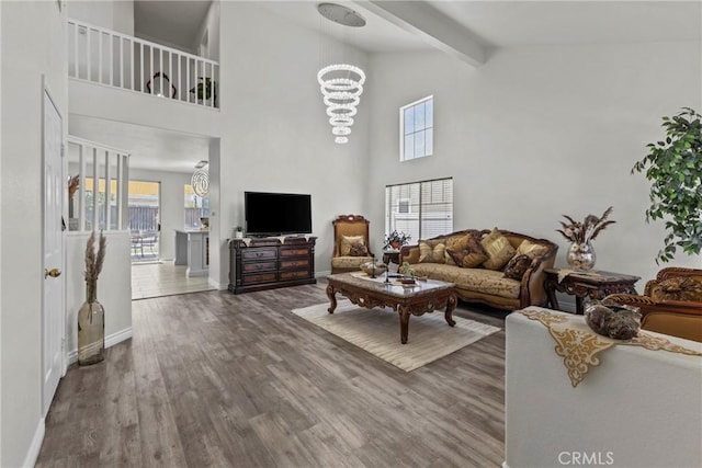 27051 Featherhill Dr, Corona, CA 92883 - living room with healthy amount of natural light, wood finished floors, high vaulted ceiling, beamed ceiling, and baseboards