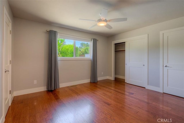1160 Kentfield Rd, Chico, CA 95926 - unfurnished bedroom with wood finished floors, a ceiling fan, and a closet
