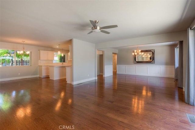 1160 Kentfield Rd, Chico, CA 95926 - unfurnished living room with a chandelier, ceiling fan, and wood finished floors