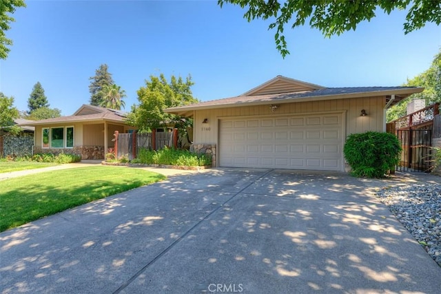 1160 Kentfield Rd, Chico, CA 95926 - ranch-style house with driveway, an attached garage, and stone siding