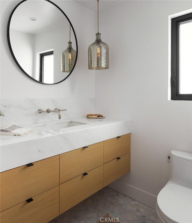 1936 Galaxy Dr, Newport Beach, CA 92660 - bathroom with vanity, plenty of natural light, toilet, and baseboards