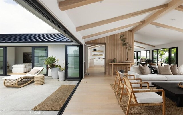 1936 Galaxy Dr, Newport Beach, CA 92660 - living area with beamed ceiling, light wood-type flooring, high vaulted ceiling, and wooden walls
