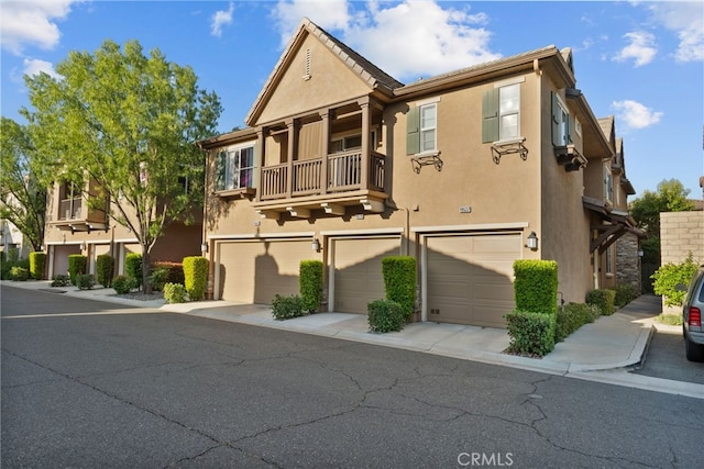19539 Laroda, Saugus, CA 91350 - multi unit property with stucco siding, a balcony, driveway, and a garage