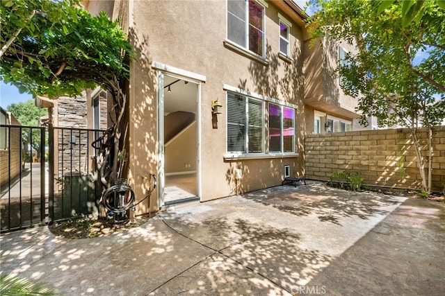 19539 Laroda, Saugus, CA 91350 - rear view of property featuring stucco siding and a patio