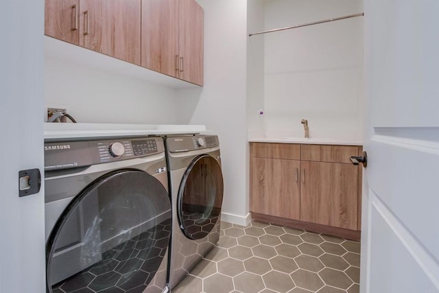 35140 Bergamot, Fallbrook, CA 92028 - laundry room featuring washing machine and dryer, cabinet space, and light tile patterned flooring