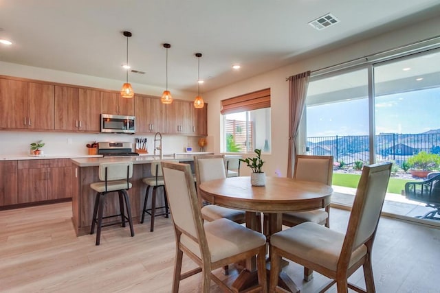 35140 Bergamot, Fallbrook, CA 92028 - dining room with light wood-type flooring and recessed lighting