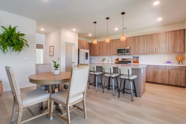35140 Bergamot, Fallbrook, CA 92028 - dining area with light wood-style floors and recessed lighting