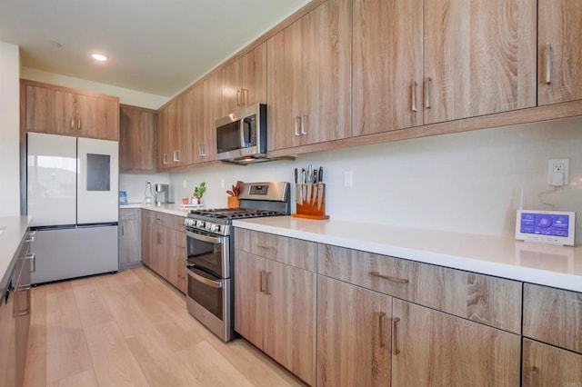 35140 Bergamot, Fallbrook, CA 92028 - kitchen featuring stainless steel appliances, light wood-type flooring, light countertops, modern cabinets, and recessed lighting