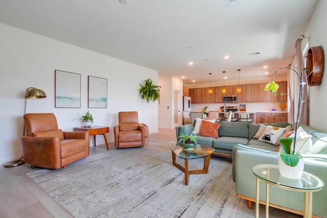 35140 Bergamot, Fallbrook, CA 92028 - living room featuring light wood-style floors and recessed lighting