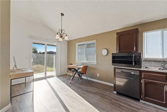 2433 N Knoll Ave, Fresno, CA 93722 - kitchen with appliances with stainless steel finishes, a chandelier, a sink, wood finished floors, and a textured ceiling