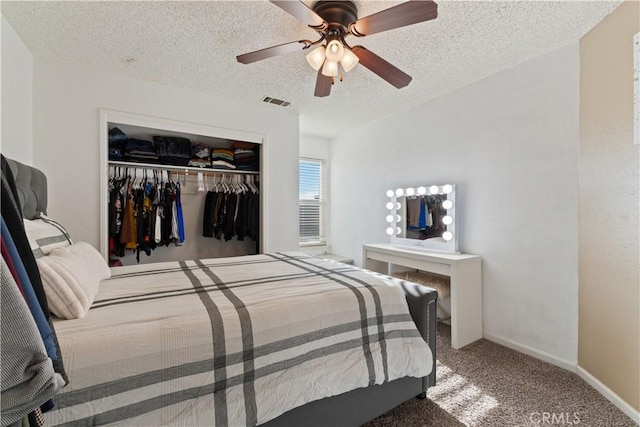 2433 N Knoll Ave, Fresno, CA 93722 - bedroom with a closet, carpet flooring, a textured ceiling, a ceiling fan, and baseboards