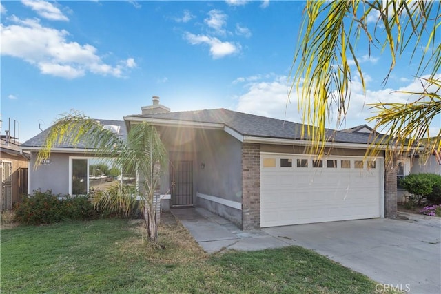 2433 N Knoll Ave, Fresno, CA 93722 - ranch-style house featuring a garage, concrete driveway, a front lawn, a chimney, and brick siding