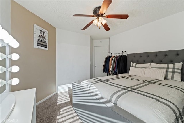 2433 N Knoll Ave, Fresno, CA 93722 - bedroom featuring carpet, a textured ceiling, baseboards, and ceiling fan