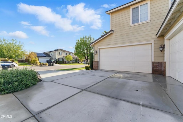 29039 Shorecliff Cir, Menifee, CA 92585 - garage with concrete driveway and a residential view