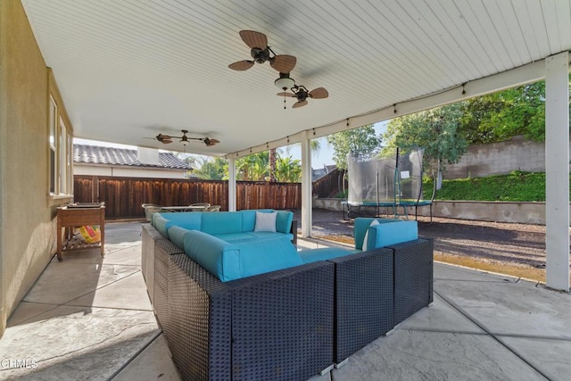 29039 Shorecliff Cir, Menifee, CA 92585 - fenced backyard featuring a trampoline, a patio, outdoor lounge area, and a ceiling fan