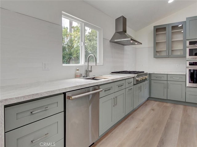 436 Cheyenne Pl, Placentia, CA 92870 - kitchen featuring stainless steel appliances, ventilation hood, gray cabinets, a sink, and decorative backsplash