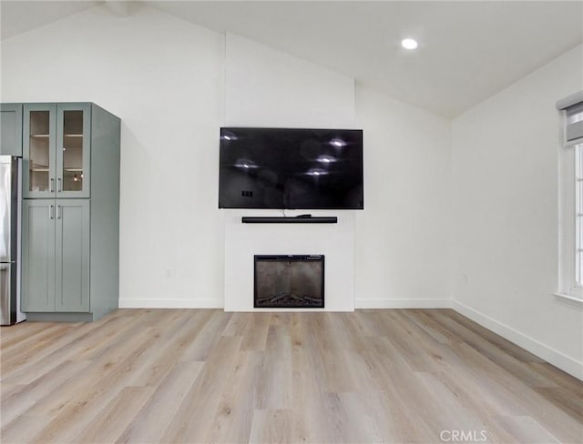 436 Cheyenne Pl, Placentia, CA 92870 - unfurnished living room featuring lofted ceiling, light wood-style flooring, a fireplace, baseboards, and recessed lighting
