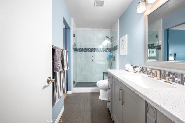 6898 Breton Way, Cypress, CA 90630 - full bathroom with toilet, vanity, a shower stall, and baseboards