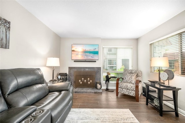 6898 Breton Way, Cypress, CA 90630 - living area with plenty of natural light, dark wood-type flooring, and a fireplace with raised hearth